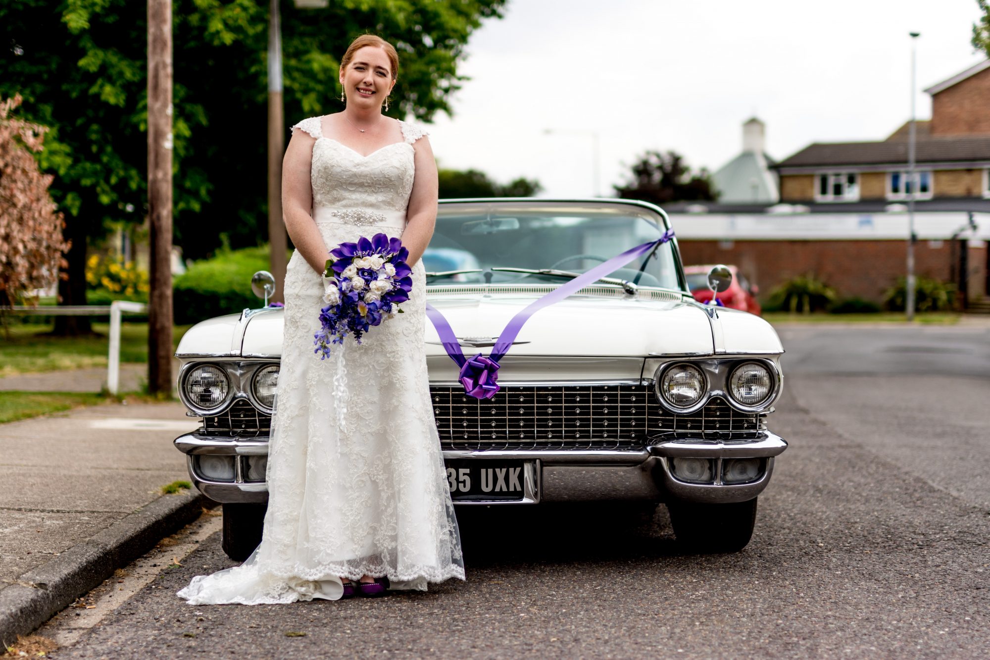 Picture of Bride with Cadillac wedding car