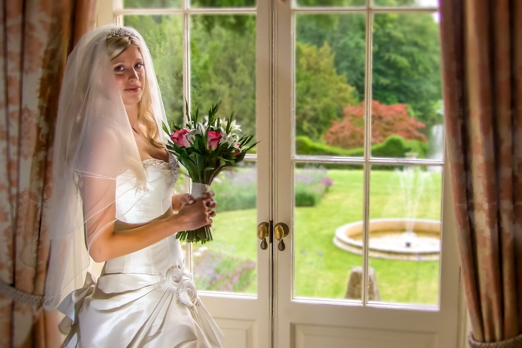 Bride photo in front of window